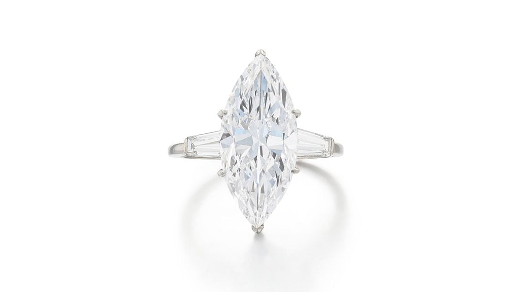 A Van Cleef & Arpels ring featuring a marquise-cut, 5.54-carat, D, VVS2 diamond between baguette-cut diamond shoulders at Sotheby's image