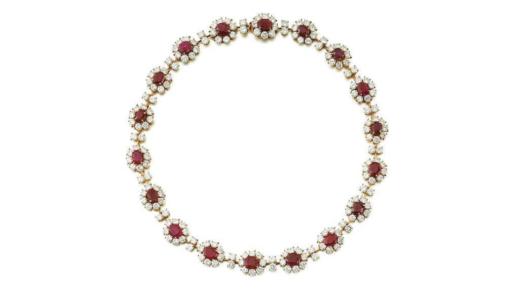 A necklace from M. Gérard with 18 oval Burmese rubies, each in a surround containing eight brilliant-cut diamonds, with the clusters spaced by pairs of brilliant-cut stones. The piece comprises approximately 36 carats of diamonds at Sotheby's image