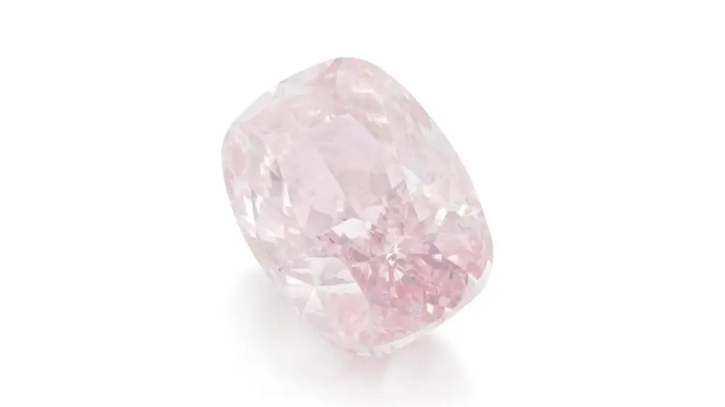 A gold necklace sporting a cushion-shaped, 4.03-carat, fancy-pink diamond by Sotheby's image