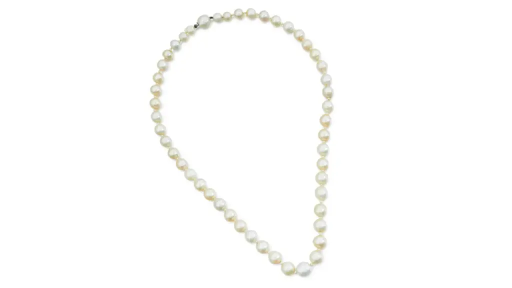 his necklace features 48 graduated natural pearls, alternating with seed pearls by Sotheby's image