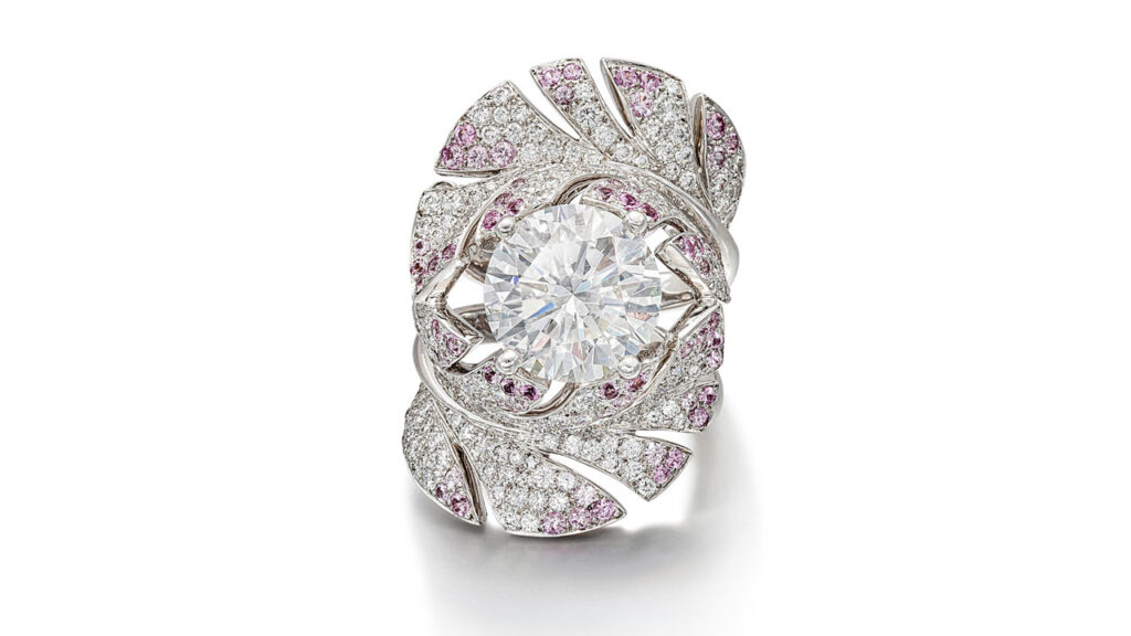 A Chanel ring, designed as two curved feathers bearing brilliant-cut diamonds and circular-cut pink sapphires around a brilliant-cut diamond center stone image