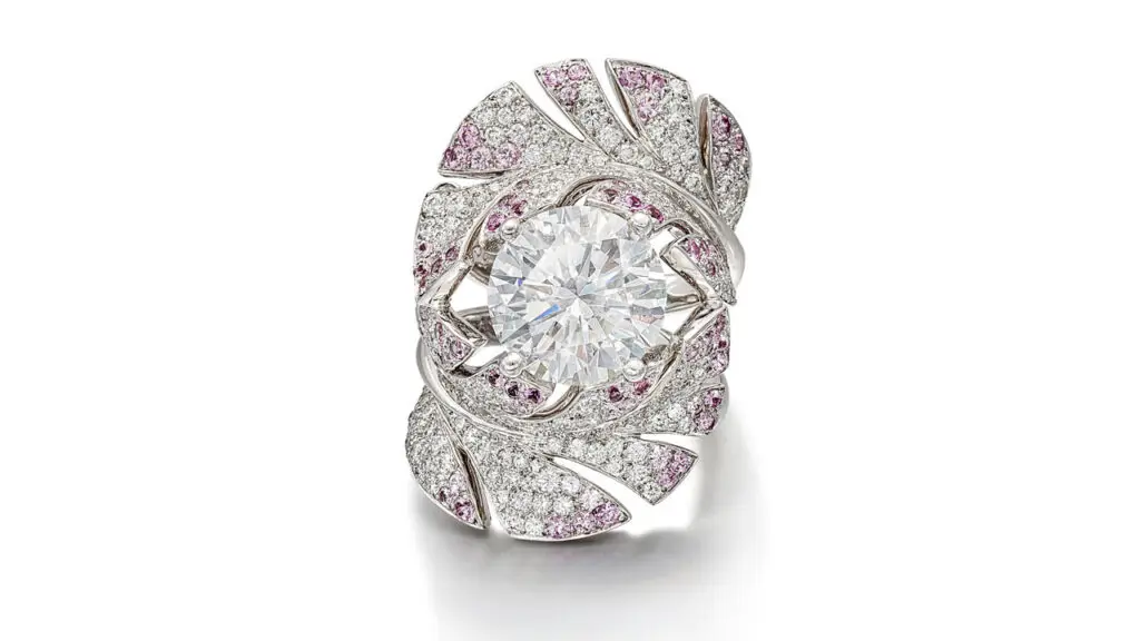 A Chanel ring, designed as two curved feathers bearing brilliant-cut diamonds and circular-cut pink sapphires around a brilliant-cut diamond center stone image