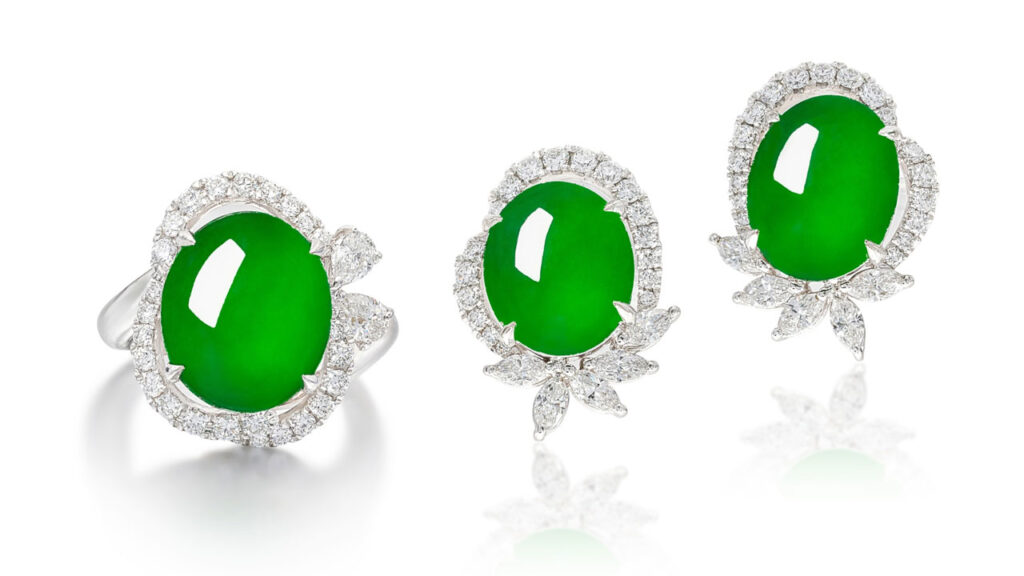 A demi-parure consisting of a ring with an oval jadeite cabochon surrounded by brilliant-cut and marquise-shaped diamonds, as well as earrings image