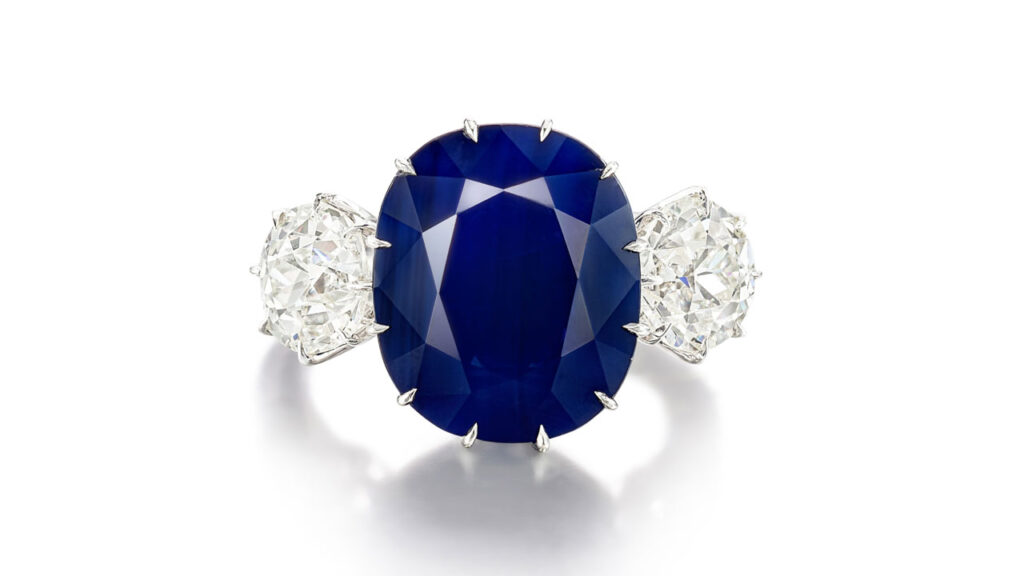 Ring featuring a cushion-shaped, Kashmir sapphire between two old European-cut diamonds at Sotheby's image