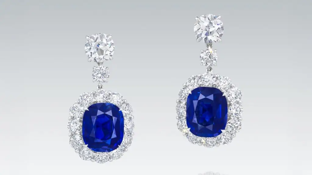 Earrings bearing cushion-shaped Kashmir sapphires, suspended from old European brilliant-cut diamonds at Christie's image