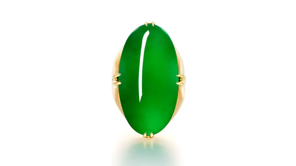 A ring containing an oval jadeite cabochon stone at Sotheby's image