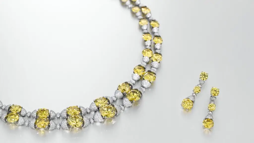 Jewelry set by designer Asprey, comprising a necklace and earrings with fancy-vivid-yellow diamonds and round white diamonds at Christie's image