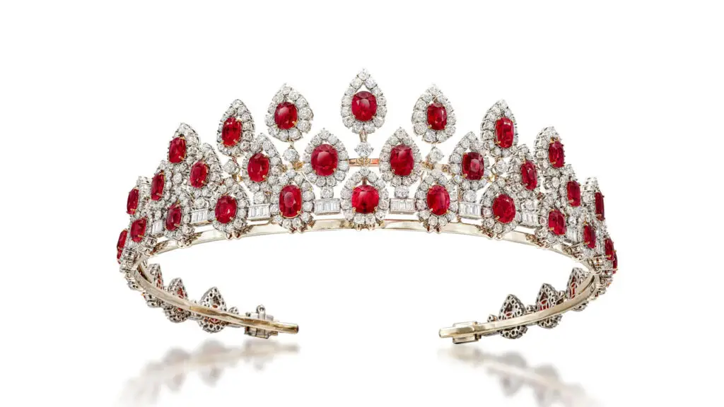 This piece is designed as a necklace that can convert to a tiara. It features a fringe of oval and cushion-cut Burmese rubies, surrounded by old European- and brilliant-cut diamond drops, all connected by trios of baguette diamonds at Sotheby's image