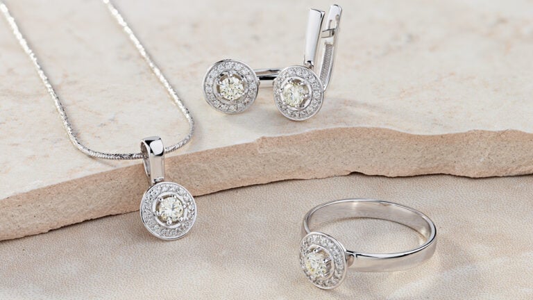 White gold ring, necklace and earrings with diamonds image