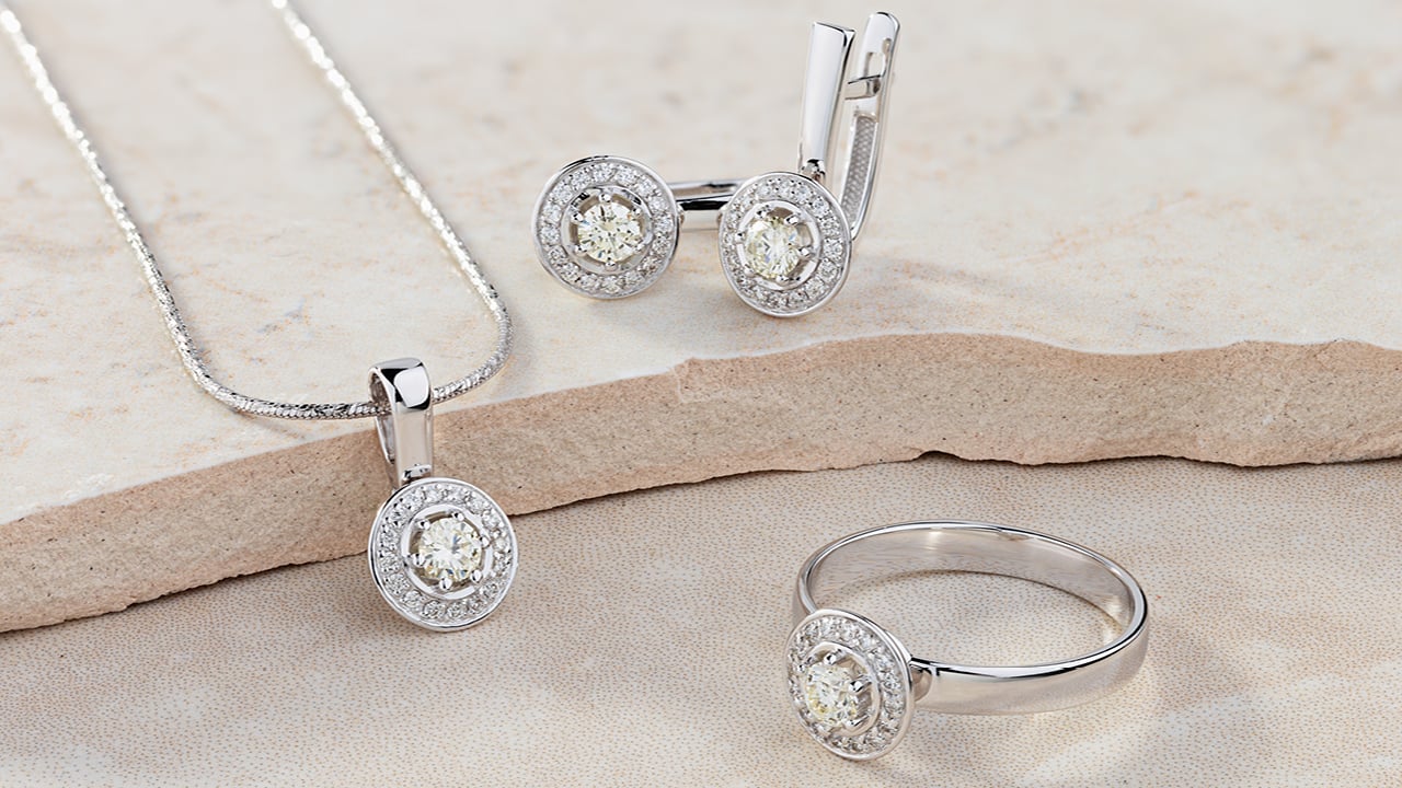 White gold ring, necklace and earrings with diamonds image