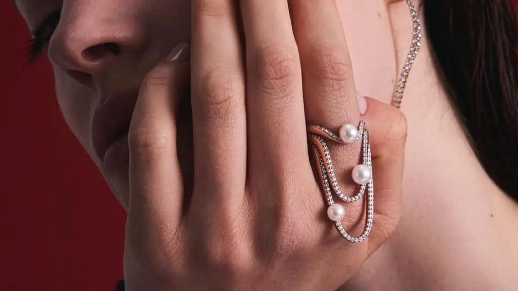 Paloma’s ring stack and other pearl and diamond jewels by Marie Mas on model image
