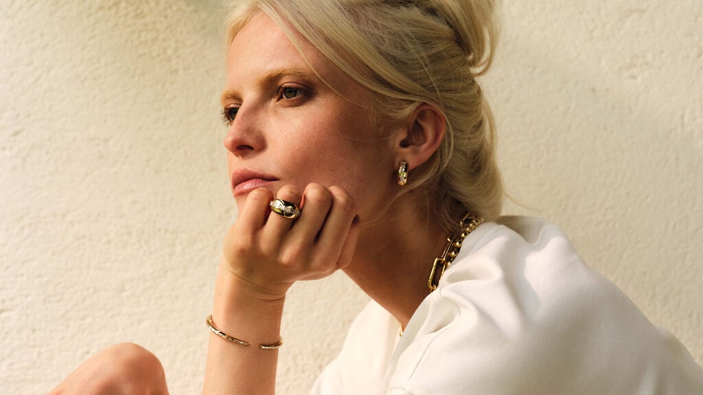 Model wearing pieces from Robinson Pelham’s Summer of ’96 collection, including the Meteor bombé ring image