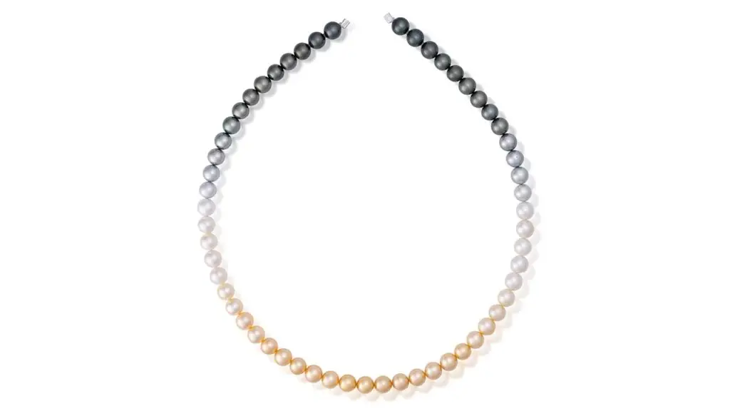 An ombré strand of cultured South Sea pearls shading from white to black to golden image