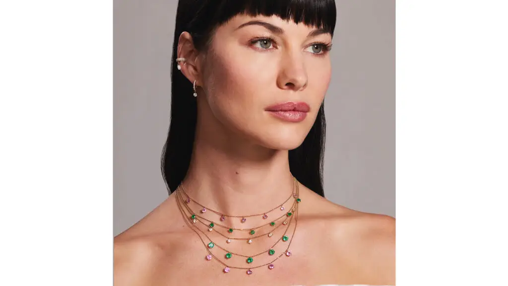 Model wearing Graziela Floating necklaces with emeralds, diamonds and pink sapphires image
