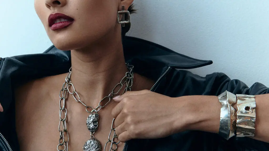 A selection of Elizabeth Hooper silver jewelry on model image