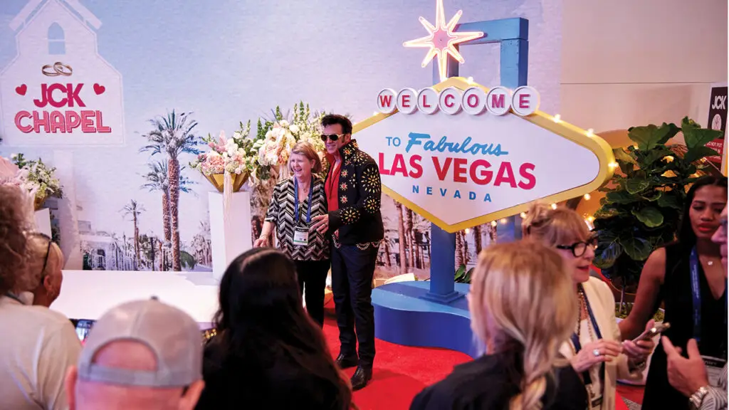 Guests pose with an Elvis impersonator at JCK’s chapel image