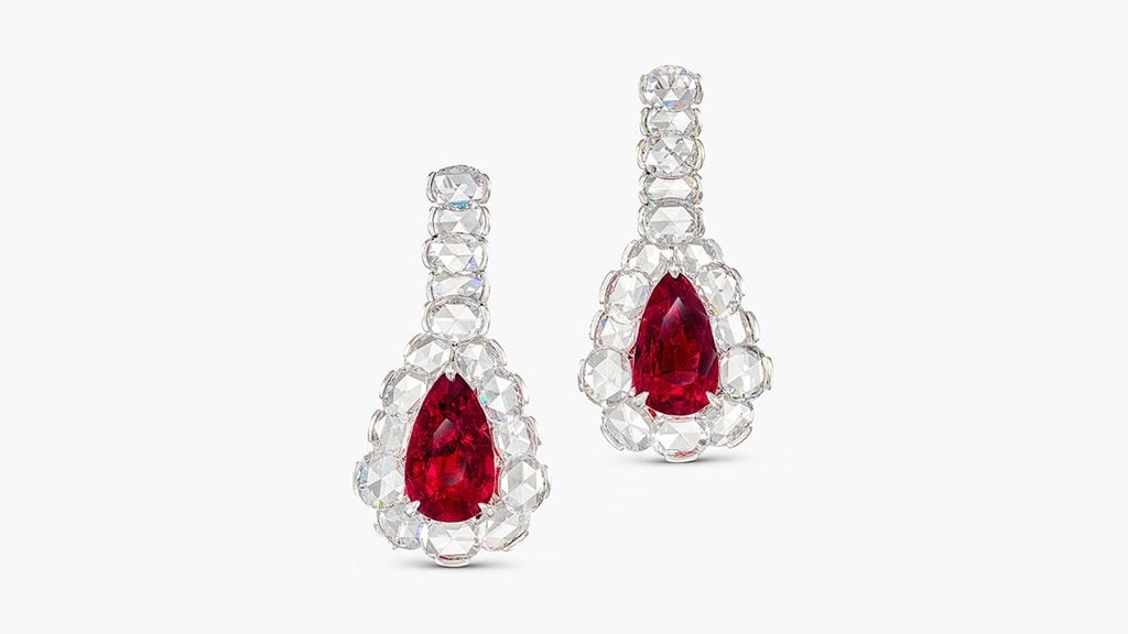 A pair of earrings featuring two pear-shaped Burmese rubies weighing 5.20 and 5.08 carats, as well as rose-cut diamonds at Sotheby's image