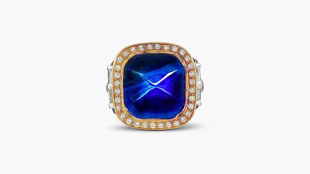 A ring with a 20.84-carat sugarloaf sapphire, cabochon sapphires, and baguette and brilliant-cut diamonds at Sotheby's image