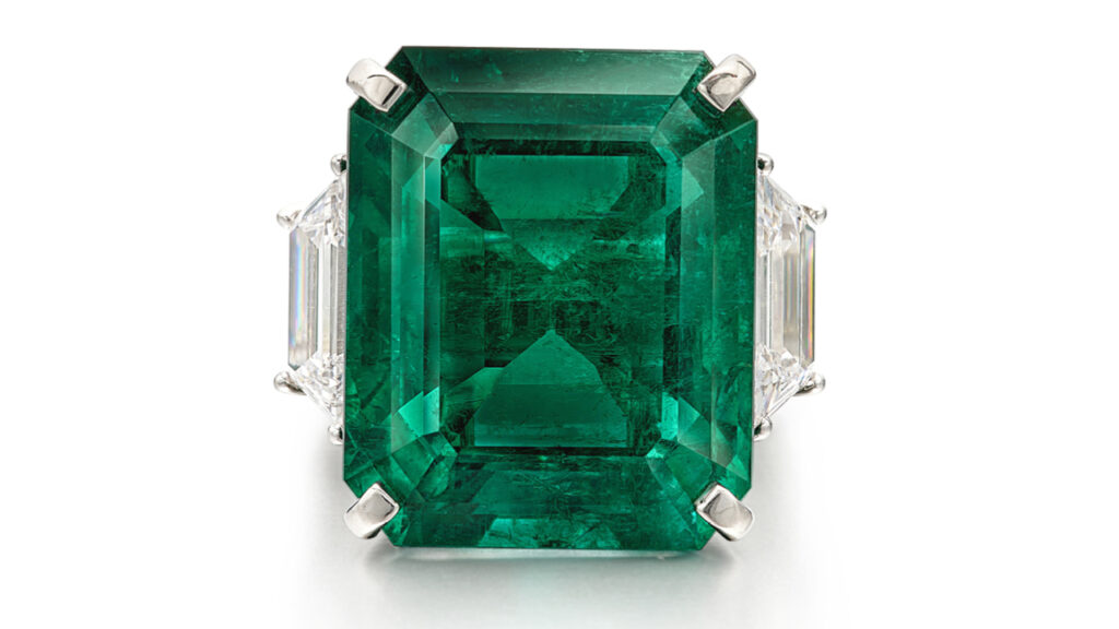 Emerald flanked by two trapeze-shaped diamonds ring, Sotheby's image