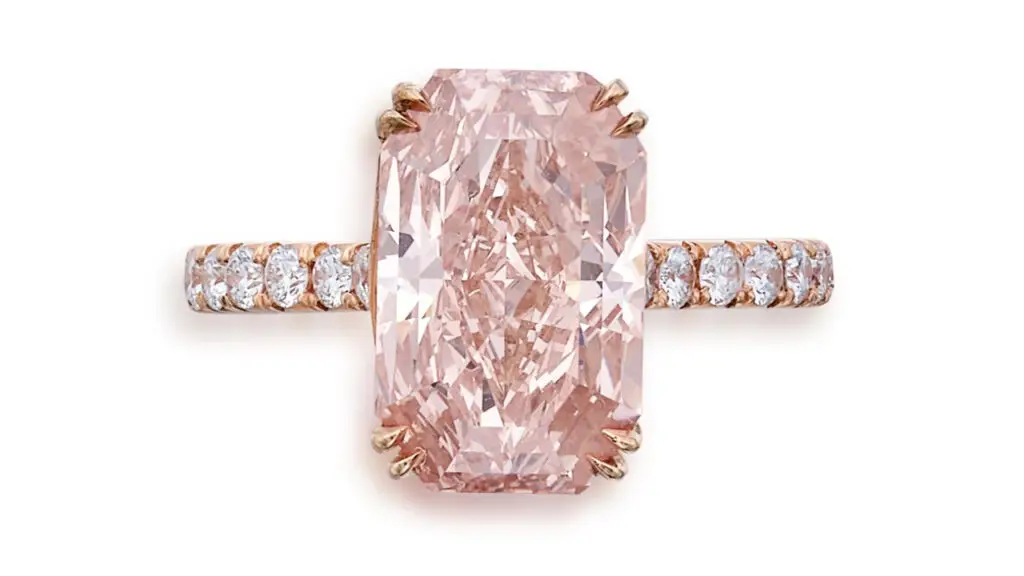 Cut-cornered rectangular mixed-cut, fancy-orangey-pink diamond ring at Sotheby's image