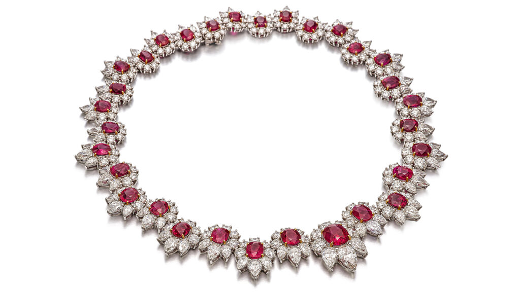 Oval and cushion-shaped Burmese ruby clusters, surrounded by brilliant-cut and pear-shaped diamonds image