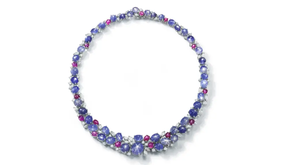 A necklace crafted around 45 star sapphires, 16 star rubies, and a mix of round and marquise diamonds image