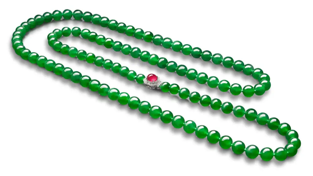 Necklace composed of 108 jadeite beads and a clasp set with a cabochon ruby and brilliant-cut diamonds image.