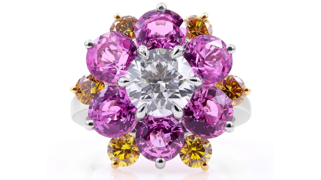 A platinum cocktail ring with a single diamond, pink sapphires, and citrines image
