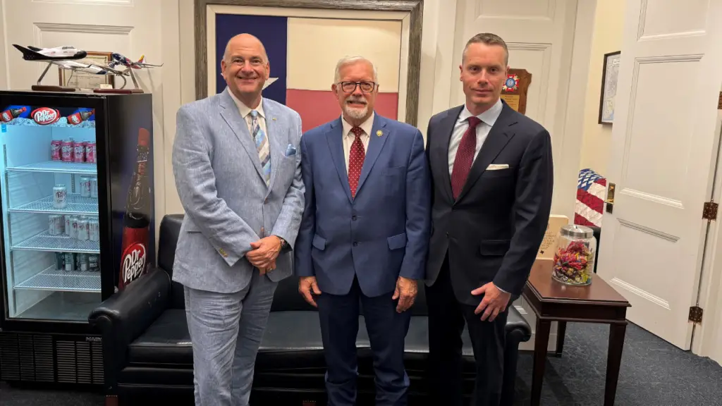 From left: AGTA CEO John W. Ford Senior, US Representative Randy Weber of Texas, and AGTA board president Bruce Bridges image