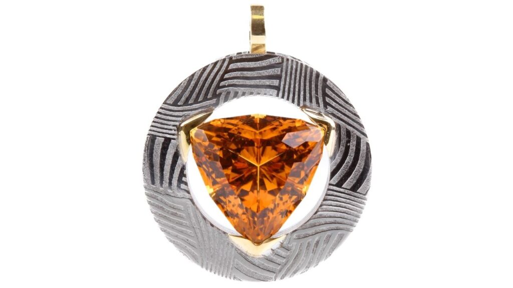 Chris Ploof pendant with a trillion-cut garnet image