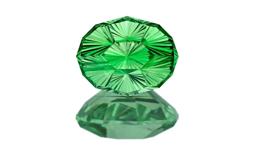 An oval concave-cut, color-zoned tsavorite garnet weighing 3.67 carats image