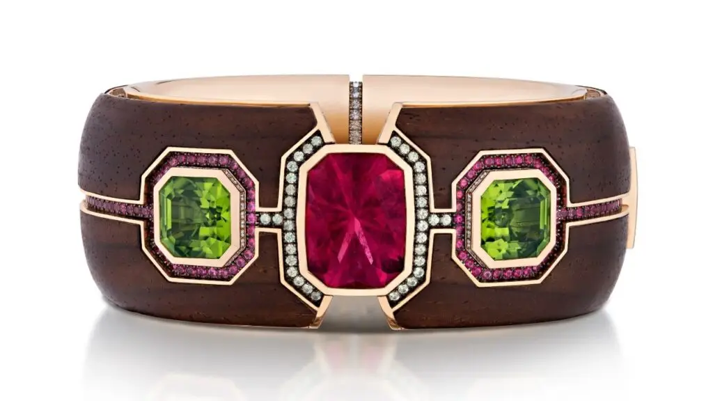 The Elements bracelet in 18-karat yellow gold, platinum, and cocobolo wood with a pink tourmaline, peridot, spinels, demantoid garnets, and diamonds image