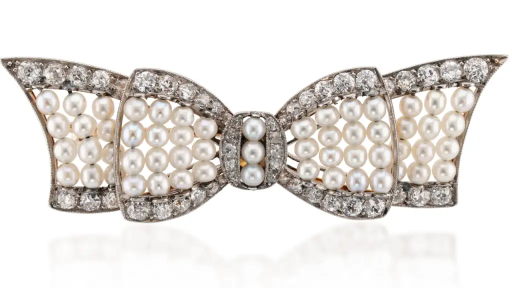 A pearl and diamond bow brooch at Paul Fisher image
