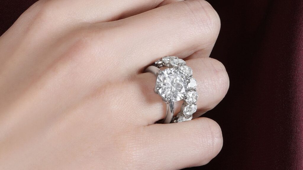 A diamond engagement ring and diamond eternity band from Gaudy Atelier image