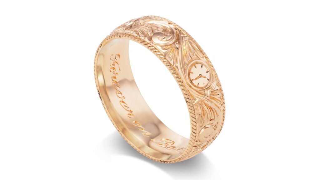 A carved gold band from Fewer Finer image