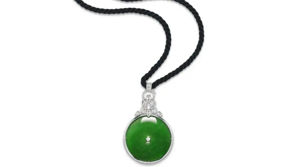 A necklace sporting a Burmese jadeite, suspended from variously cut diamonds, made more than 38 times its high estimate at Christie's image