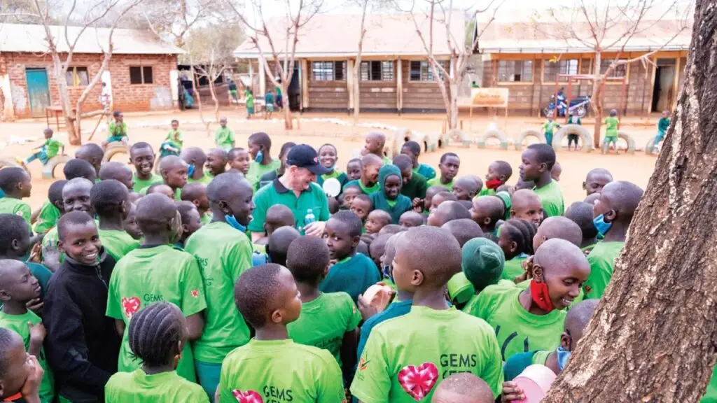 Damien Cody surrounded by children in Kenya’s Kamtonga village image