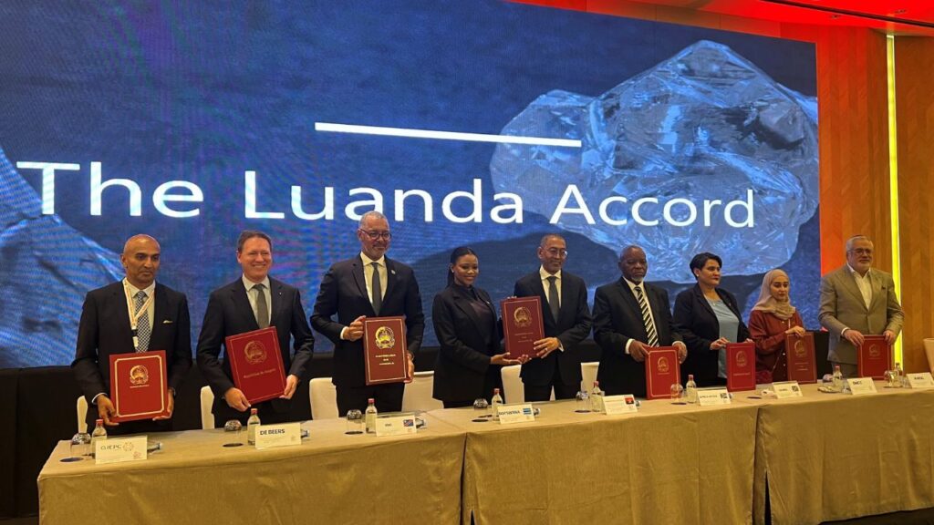 Representatives of industry bodies and diamond-producing countries stand at the signing of the Luanda Accord image