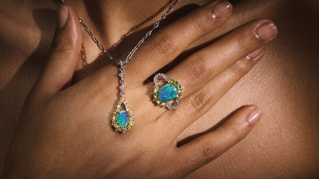 A necklace and ring from Cheal Opal featuring black opal, diamonds, and yellow sapphires in platinum image