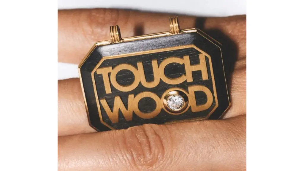 Marie Lichtenberg pendant in wood, gold and diamond with the words Touch Wood image