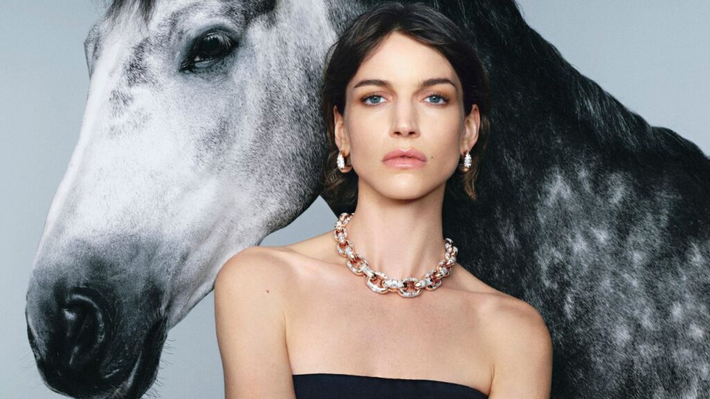 Model wearing a gold and diamond necklace and earrings from Pomellato's Iconica Extreme collection image