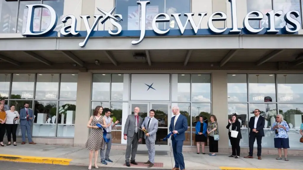 A ribbon-cutting ceremony outside the remodeled Day’s Jewelers branch in Manchester, New Hampshire image