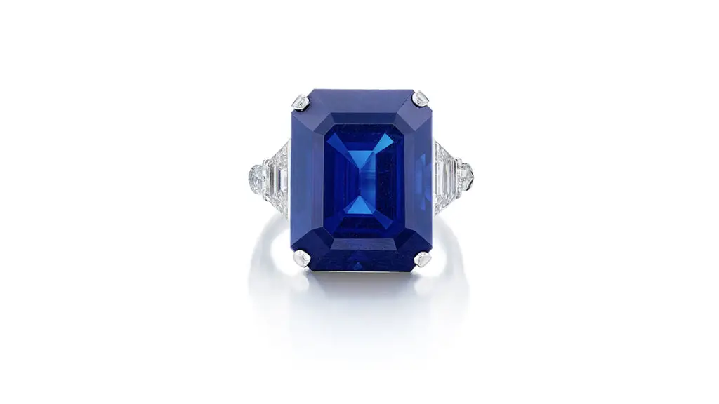 Ring featuring an emerald-cut Burmese sapphire flanked by trapezoid- and bullet-cut diamonds at Sotheby's image