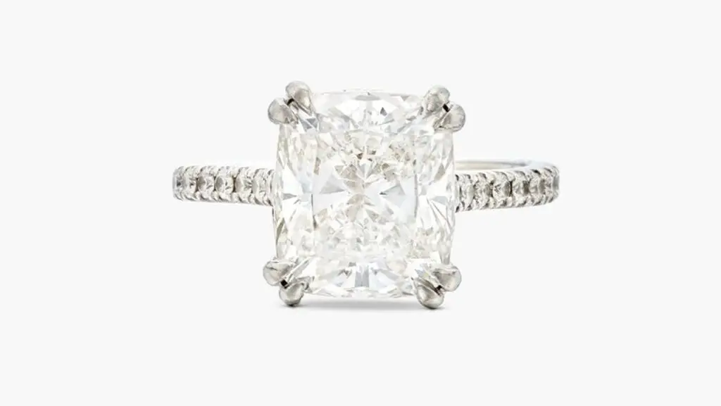 This ring features a cushion-cut, 5.01-carat, E, VS1 diamond with the shoulders enhanced by round diamonds at Sotheby's image