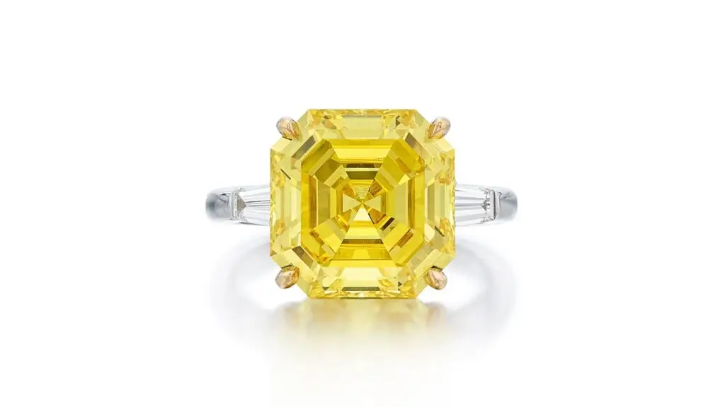Ring featuring a square emerald-cut fancy-vivid-yellow diamond, set between a pair of tapered baguette diamonds at Sotheby's image