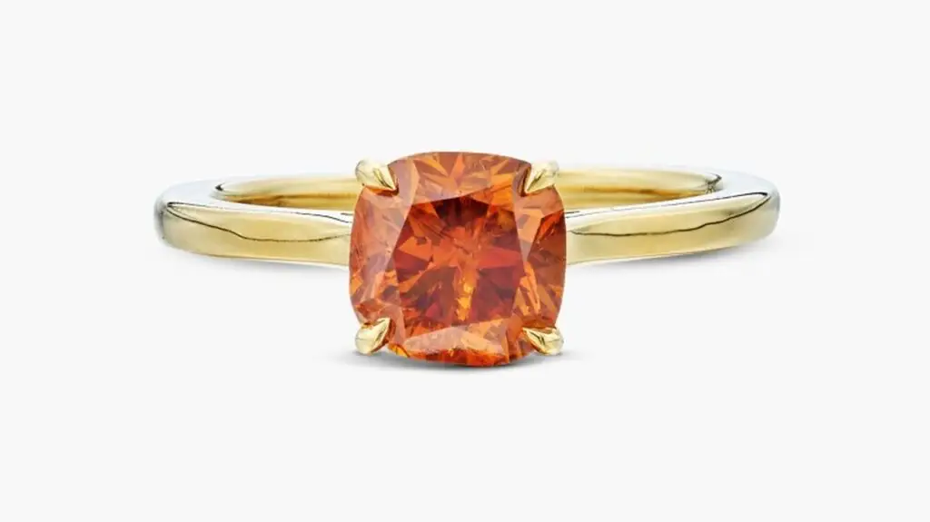 This ring stars a cushion modified brilliant-cut, 1.56-carat, fancy-deep-orange diamond at Sotheby's image