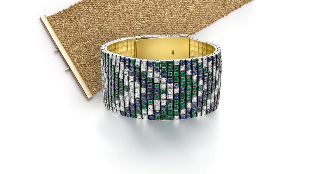 Woven bracelet in 18-karat gold by Carolina Bucci (top) and Tapestry cuff by Jessica McCormack in 18-karat gold with carrè-cut diamonds, emeralds and sapphires image