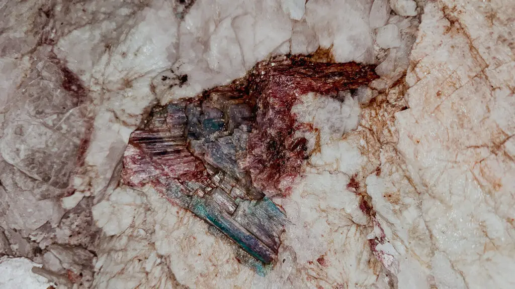 Paraiba tourmaline in its host rock image