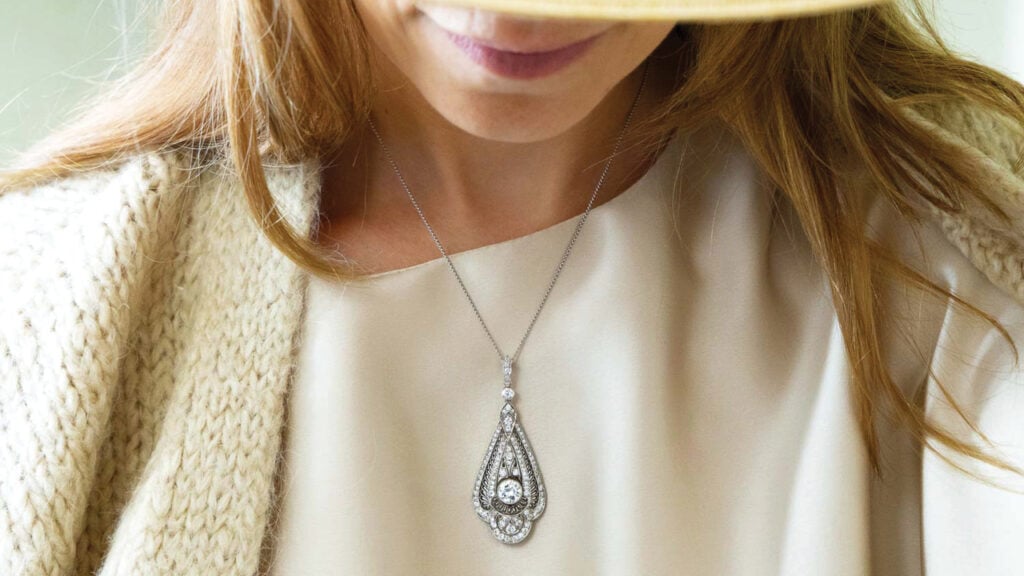 Model wearing a diamond pendant from Jewelers Circle image
