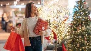 A woman shopping for holiday gifts image